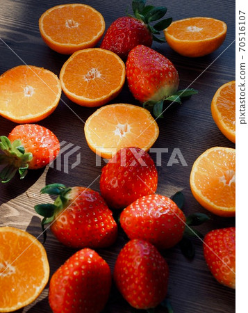 Fresh organic fruits strawberries, tangerines, pomegranates Fresh organic fruits strawberries, tangerines, pomegranates 70516107