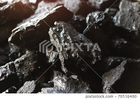 Large chunks of brown coal close-up. Mining and fuel production. 70516480