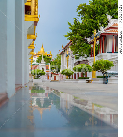 Loha Prasat Wat Ratchanatda and Golden Mountain pagoda, a buddhist temple or Wat Saket with skyscraper buildings in Bangkok Downtown, urban city, Thailand. Thai Landmark. Architecture. Loha Prasat Wat Ratchanatda and Golden Mountain pagoda, a buddhist temple or Wat Saket with skyscraper buildings in Bangkok Downtown, urban city, Thailand. Thai Landmark. Architecture. 70517528