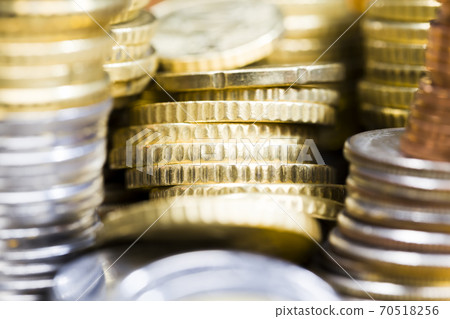 different colors and denominations of coins 70518256
