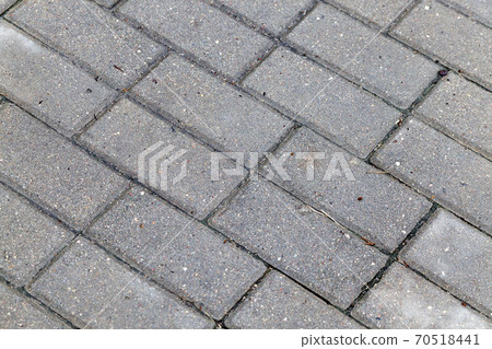 a road made of concrete tiles for pedestrian 70518441