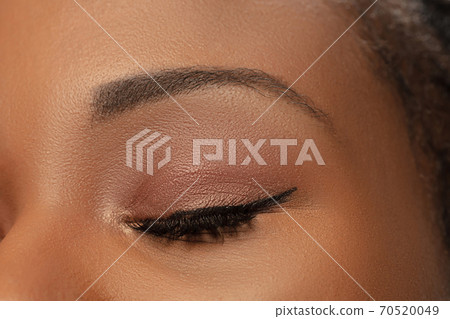 Portrait of beautiful african-american woman isolated on white studio background. Beauty, fashion, skincare, cosmetics concept. 70520049