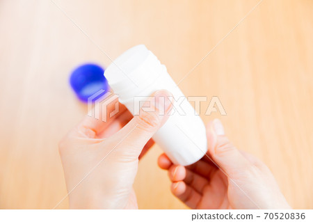 Poultice stick hand copy space 70520836