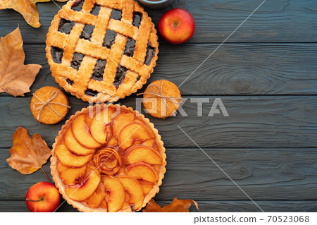 Thanksgiving berry and apple various pies on wooden surface, top view Thanksgiving berry and apple various pies on wooden surface, top view 70523068