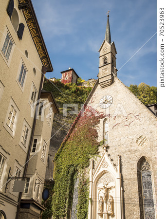 An old church and house of the 18th century in Salzburg An old church and house of the 18th century in Salzburg 70523963