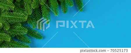 Top view Banner of colorful festive background made of fir tree branch. Christmas holiday concept with copy space 70525173