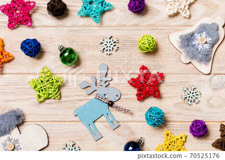 Top view of Christmas toys on wooden background. New Year ornament. Holiday concept 70525176