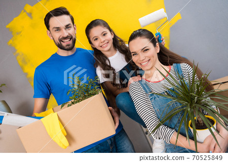 Happy family standing against the background. Happy family standing against the background. 70525849