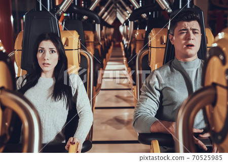 Man and woman scared while riding roller coaster. Stock Photo