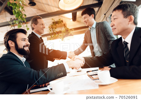 Meeting with chinese businessmen in restaurant. Meeting with chinese businessmen in restaurant. 70526091