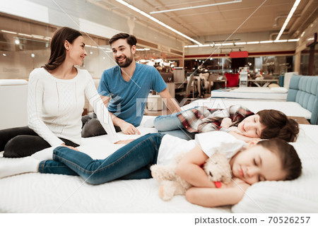 Young children are tired and fall asleep on bed. Young children are tired and fall asleep on bed. 70526257