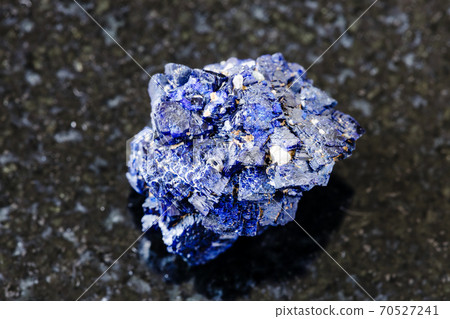 raw Azurite mineral crystals on black granite 70527241