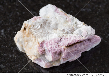 unpolished pink Tourmaline in feldspar on black 70527472