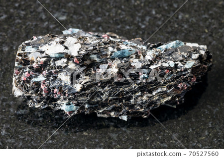 raw Biotite rock with Kyanite crystals on black 70527560