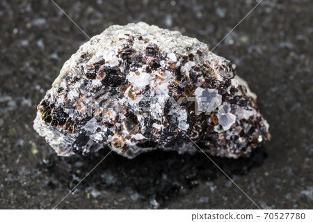 raw Phlogopite (magnesium mica) rock on black raw Phlogopite (magnesium mica) rock on black 70527780