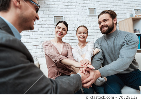 A man with glasses a psychologist smiles.  70528112