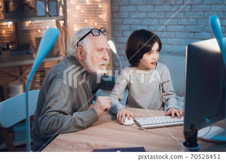 Little grandson plays better than grandfather.  70528451