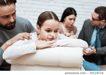 Dad tries to talk with his daughter in the office. Dad tries to talk with his daughter in the office. 70528516