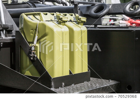 fuel can is attached to the Board of a truck 70529368