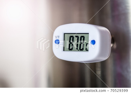 the thermometer shows the temperature in degrees the thermometer shows the temperature in degrees 70529399