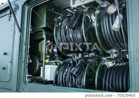 mobile workshop in the back of a trailer filled with equipment for maintenance 70529405