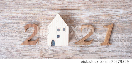 2021 Happy New Year with house model on table wooden background. Banking, real estate, investment, financial, savings and New Year Resolution concepts 2021 Happy New Year with house model on table wooden background. Banking, real estate, investment, financial, savings and New Year Resolution concepts 70529809