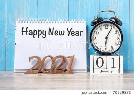 2021 Happy New Year  with notebook, black retro alarm clock and wooden number. New Start, Resolution, Goals, Plan, Action and Mission Concept 70529828