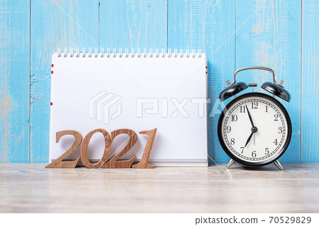2021 Happy New Year  with blank notebook, black retro alarm clock and wooden number. New Start, Resolution, Goals, Plan, Action and Mission Concept 70529829