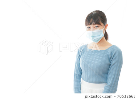 Young woman wearing a mask Young woman wearing a mask 70532665