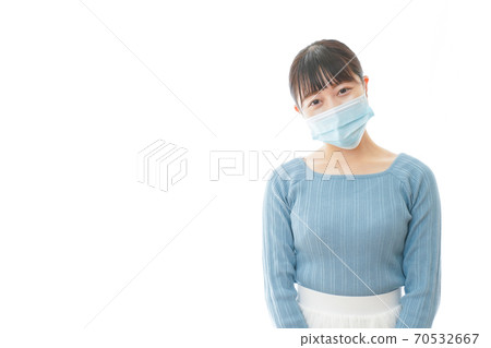 Young woman wearing a mask Young woman wearing a mask 70532667