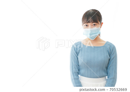 Young woman wearing a mask Young woman wearing a mask 70532669