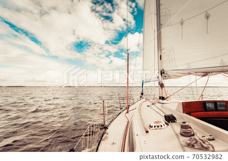 Yachting on sail boat during sunny weather 70532982