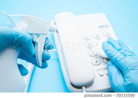 Alcohol disinfection of telephones, infection prevention 70533590