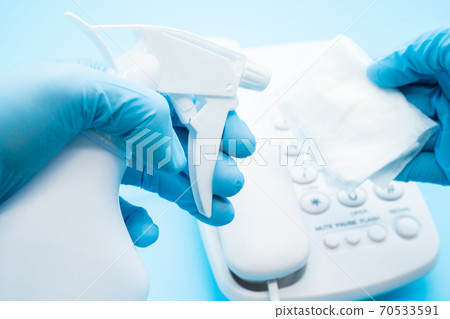 Alcohol disinfection of telephones, infection prevention Alcohol disinfection of telephones, infection prevention 70533591