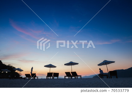 umbrella on beach under vivid colorful of sky 70533779