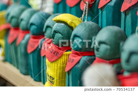 Small figures representing the souls of deceased children at Hanibe caves, Komatsu, Ishikawa Prefecture, Japan. 70534137