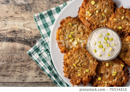 Traditional Jewish latkes or potato pancakes 70534810