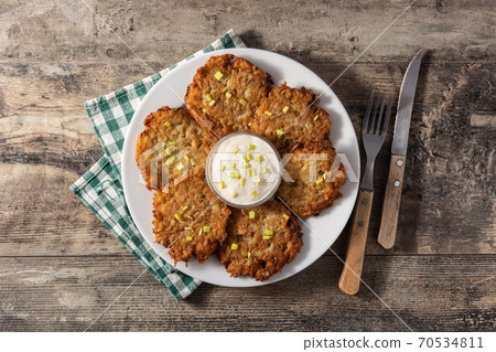 Traditional Jewish latkes or potato pancakes 70534811