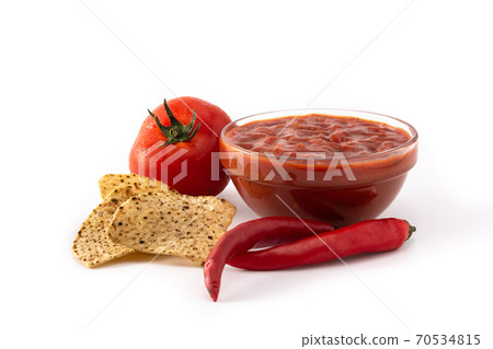 Spicy chili sauce in bowl with nacho chip isolated on white background 70534815