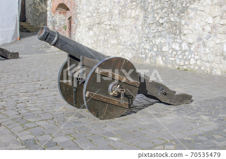 Old metal cannon on the wall of the fortress. 70535479