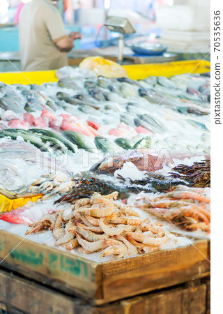 Fish market with freshly caught shrimps and seafood. 70535636