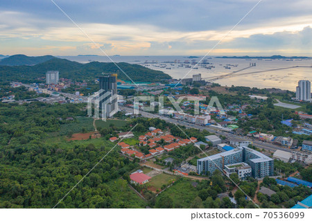 Aerial view of residential buildings in Sri Racha district with sea, Chonburi skyline, Thailand. Urban city in Asia. Architecture landscape background. Aerial view of residential buildings in Sri Racha district with sea, Chonburi skyline, Thailand. Urban city in Asia. Architecture landscape background. 70536099