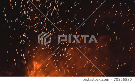 close up of sparks from fire, sparks on black background, extravaganza of fire, magic with sparks. 70536880