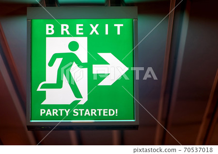 The emergency exit sign shows the direction of escape in case leave European Union.  70537018