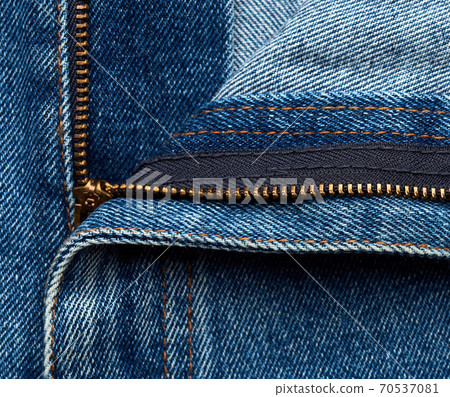 iron yellow zipper on the fly on blue jeans iron yellow zipper on the fly on blue jeans 70537081