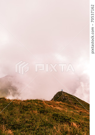 At the top of the mystical mountain in the clouds Gutyn Tomnatyk, epic views, breathtaking landscapes and realities of the Carpathians. At the top of the mystical mountain in the clouds Gutyn Tomnatyk, epic views, breathtaking landscapes and realities of the Carpathians. 70537162