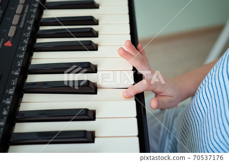 hands black white piano keys synth. close-up. 70537176