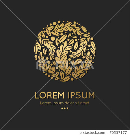 Golden emblem with leaves in a circle shape.  70537177