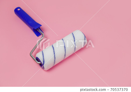 Paint roller isolated on pink Paint roller isolated on pink 70537370