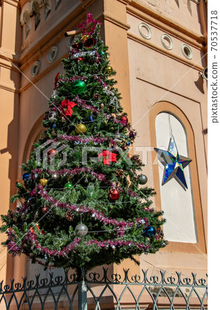 The Church of St. Joan of Arc at Ho Chi Minh city with festive decoration of a Christmas tree The Church of St. Joan of Arc at Ho Chi Minh city with festive decoration of a Christmas tree 70537718